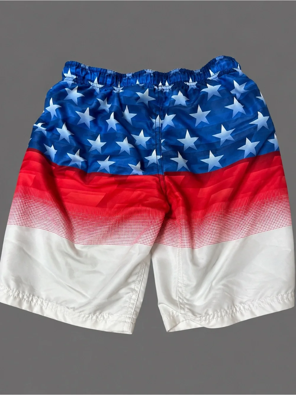 Under Armour Boy’s Red/White/Blue Star Print Swim Trunks NWOT